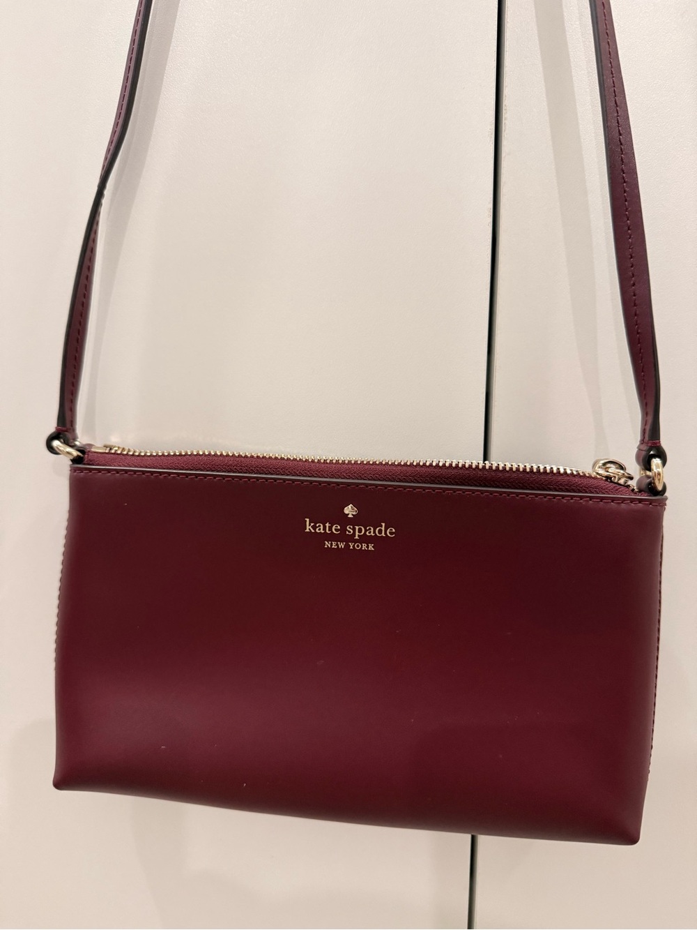 kate spade burgundy leather crossbody with gold hardware